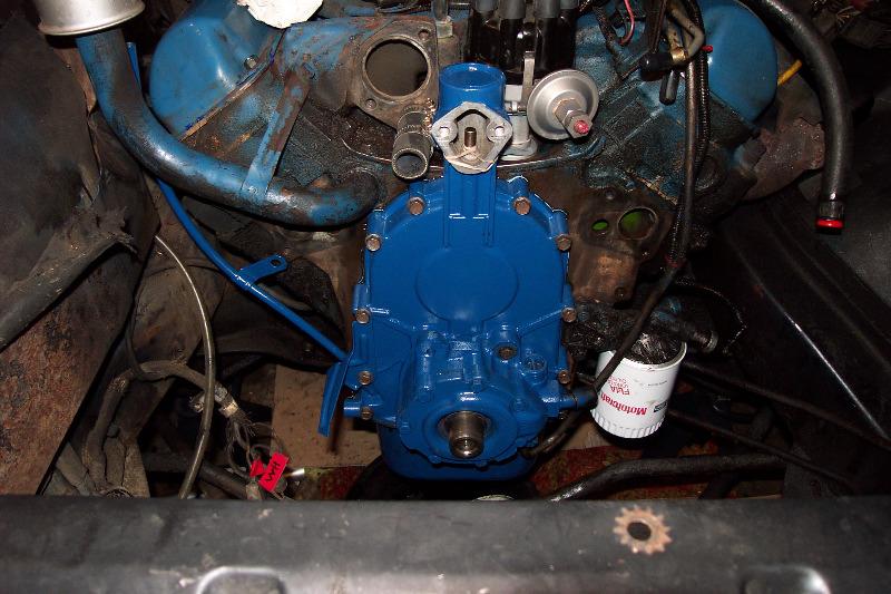 With the oil pan loose, I bolted in the timing cover, but not before pouring some oil onto the new timing chain.