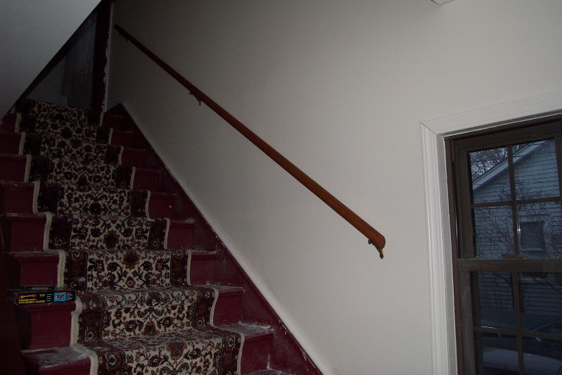 A hand rail and some trim clean up the steps, but more needs to be done here.