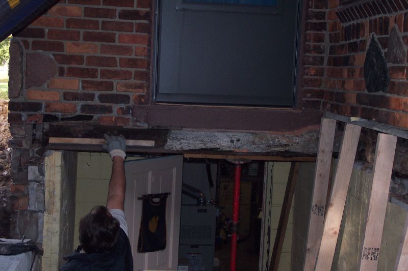 Chuck works on removing the old beam.