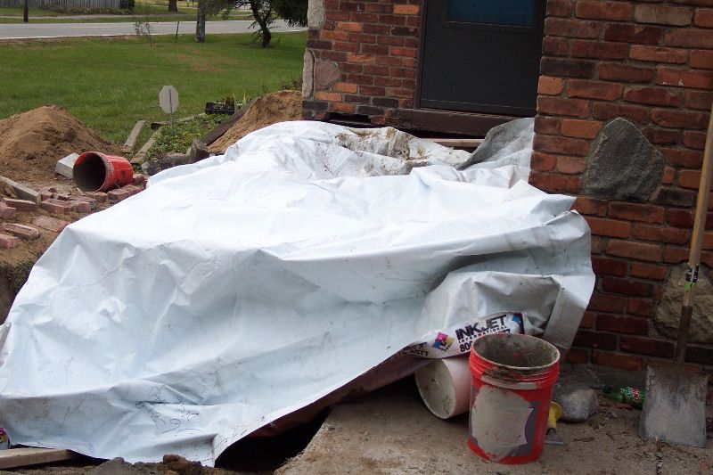 They tarped over the porch opening to keep out the rain (which we've had none).